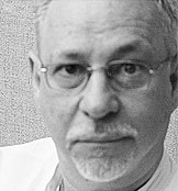 Headshot of Domingo Gonzalez, looking at the camera.