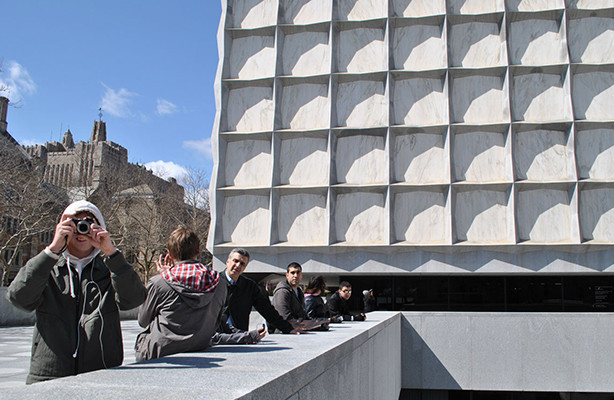 Seven BArch students standing in front of an architectural building.