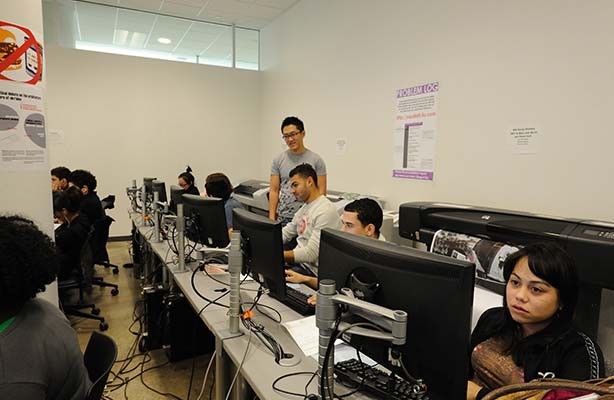 Four Master of Science in Architecture students working on their architectural projects in the flagship public architecture school in NYC, the Spitzer School of Architecture.