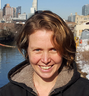 Headshot of Andrea Parker, smiling at the camera.