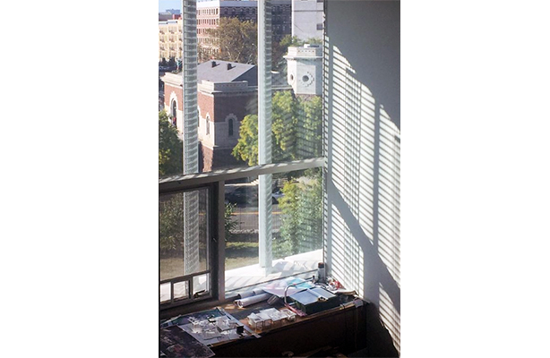 An interior view of the studio at the top-tier Spitzer School of Architecture, showcasing the shading device on the facade of the building.