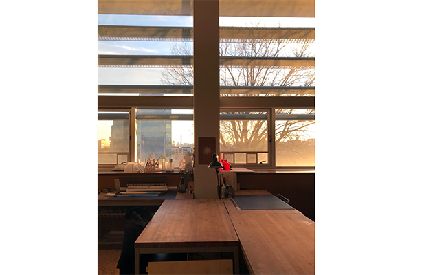 An interior view of the studio at the high-quality Spitzer School of Architecture during sunset.