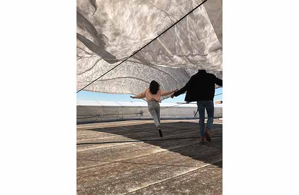 Girl running under concrete break installation