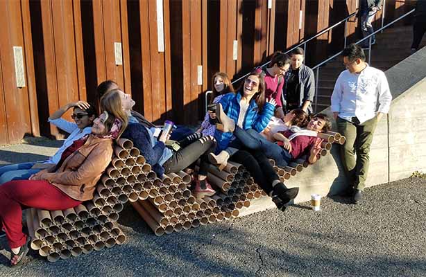 group sitting on installation