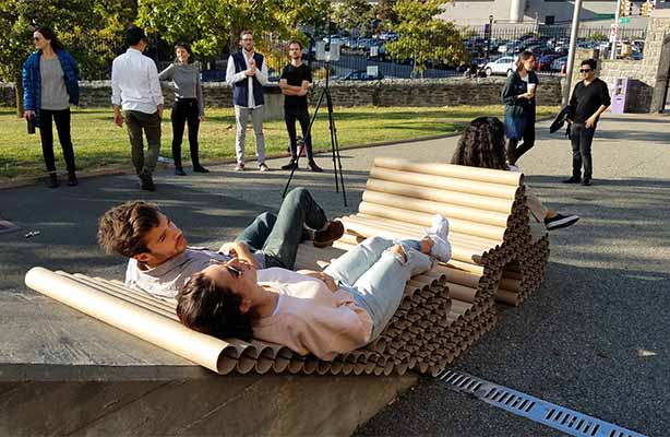 two people sitting on installation