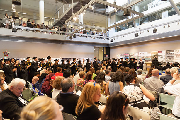 photo: graduation line-up in Spitzer School Gallery