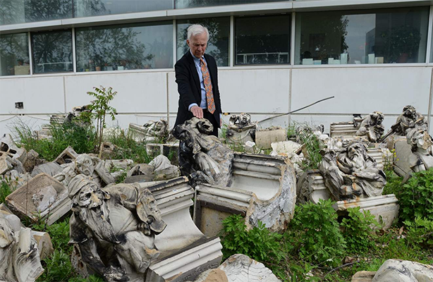 Photo of the Dean with statues