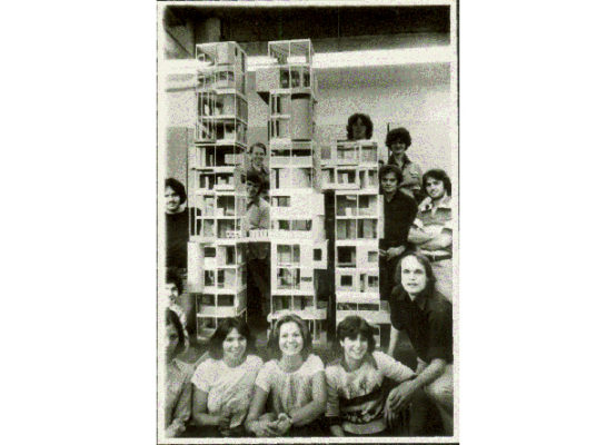 Twelve B.Arch students standing around an architectural model in the Spitzer School of Architecture