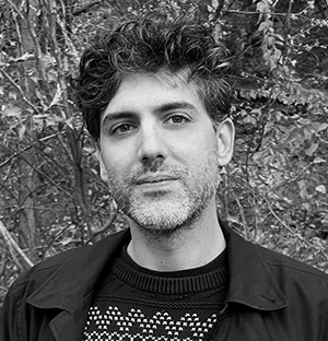 Headshot of John Kirsimagi, looking forward