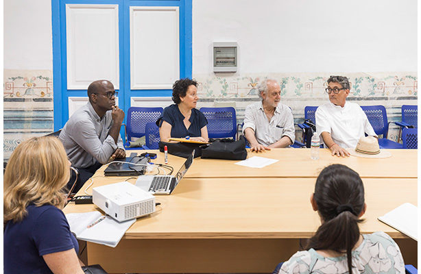 photo: Michael Sorkin, second from left, discussing project goals following site visits in Havana.