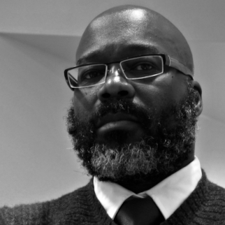 Headshot of Mitchell Squire, looking at the camera.