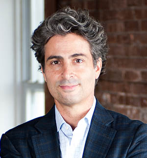 Headshot of Dominick Pilla, smiling at the camera.