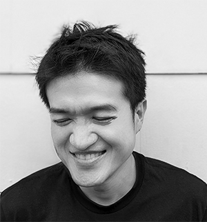 Headshot of Cheng Yi Lin, looking down and smiling.