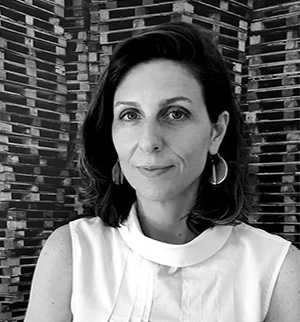 Headshot of Laura Sara Wainer, smiling at the camera.