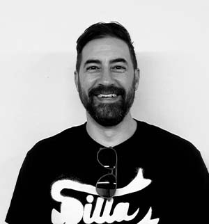 Headshot of Anthony Buccellato, smiling at the camera.