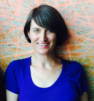 Headshot of Kaja Kuehl, smiling at the camera.