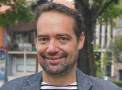 Headshot of Miguel Rabago smiling at the camera.