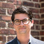 Headshot of Paul Farber smiling at the camera.