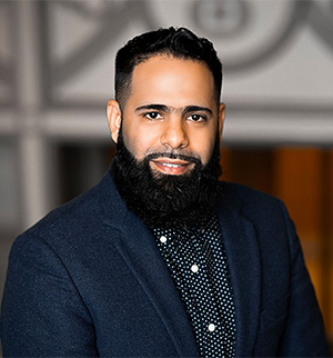 Headshot of Jason Garcia, smiling at the camera.