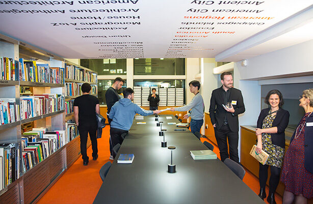 Eight individuals, including students, faculty, and staff, gathered in the Sorkin Reading Room at the affordable Spitzer School of Architecture in NYC.