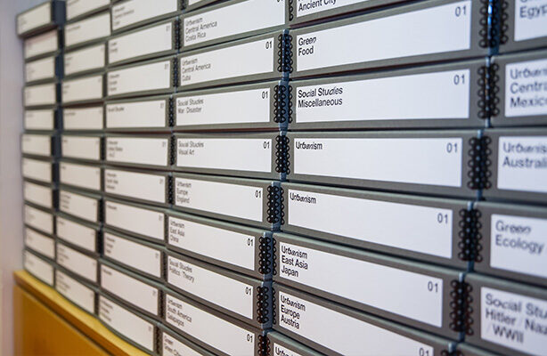 A wall showcasing a donated collection in the Sorkin Reading Room at the budget-friendly Spitzer School of Architecture in NYC.