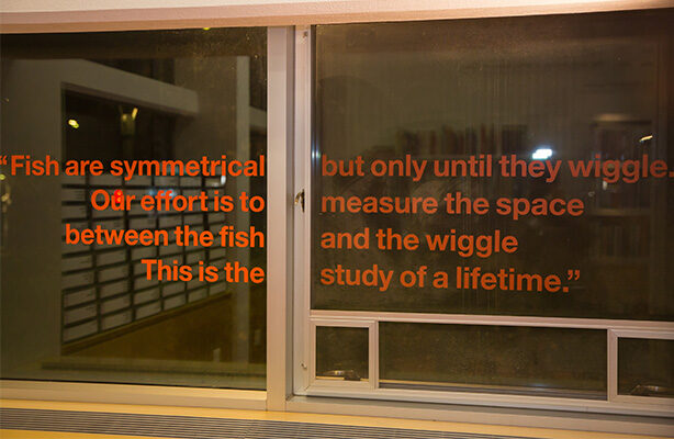 A vinyl window sticker featuring a quote is attached to the windows of the Sorkin Reading Room at the high-quality Spitzer School of Architecture.