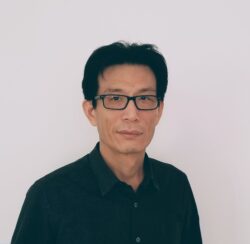 Headshot of Shiqiao Li, dressed in black, facing the camera.