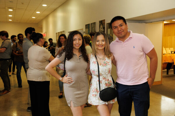 Three B.Arch students stand and smile outside the Sciame Auditorium after the Spitzer Award Ceremony.