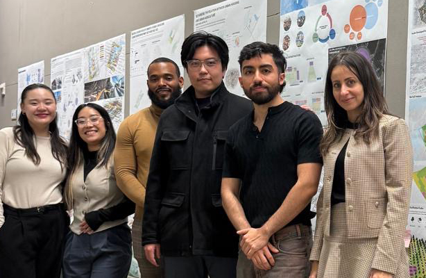 group photo of UD capstone students with drawings in background