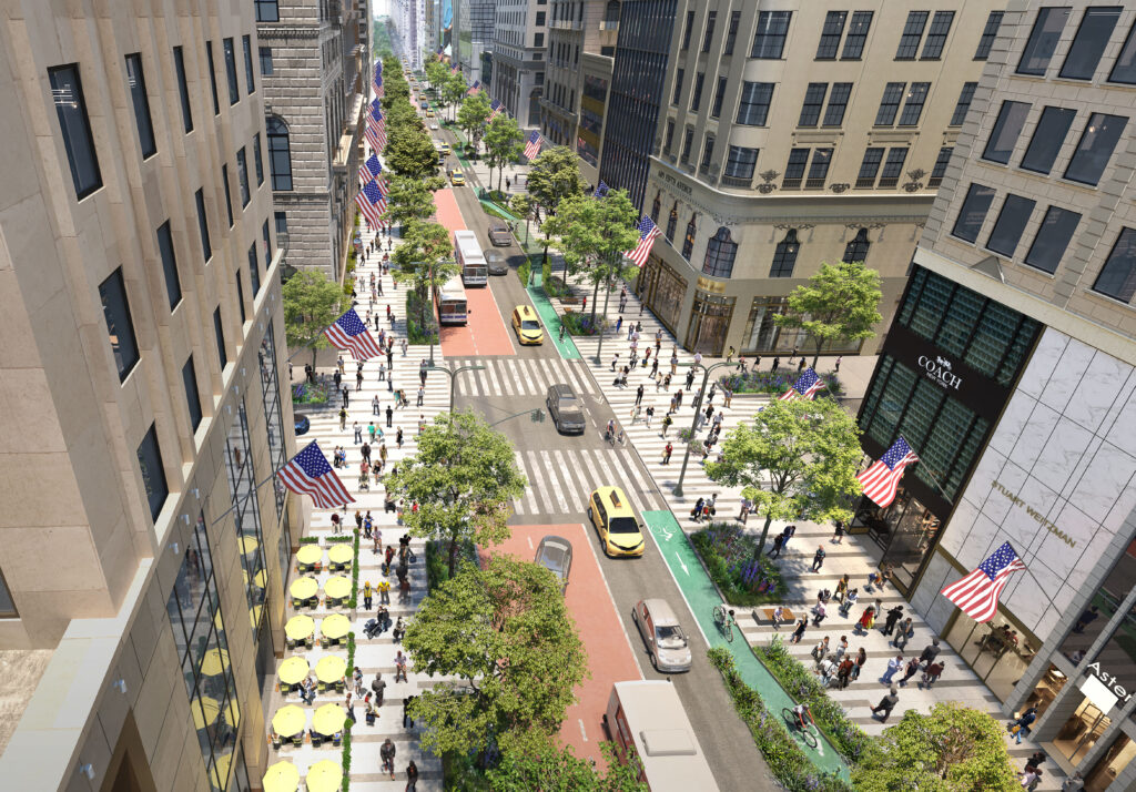 An overhead architectural rendering of a revitalized Fifth Avenue in New York City. The street features widened, light-gray stone pedestrian plazas lined with lush green trees, garden beds, and outdoor seating with yellow umbrellas. A dedicated two-way green bike lane runs along one side, while the center of the street is divided into a red bus lane and a single lane for vehicle traffic, including iconic yellow taxis. American flags hang from the historic buildings that line the busy thoroughfare, which is filled with diverse groups of people walking, cycling, and shopping.